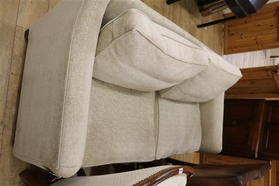 A two seater settee, upholstered in herringbone pattern beige fabric, W.6ft